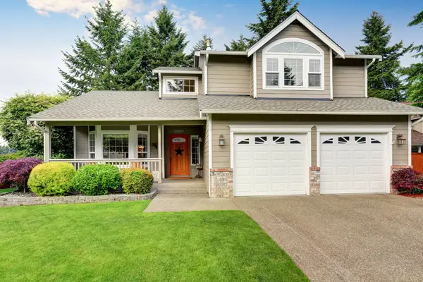 American style suburban home with mixed siding and attached garage
