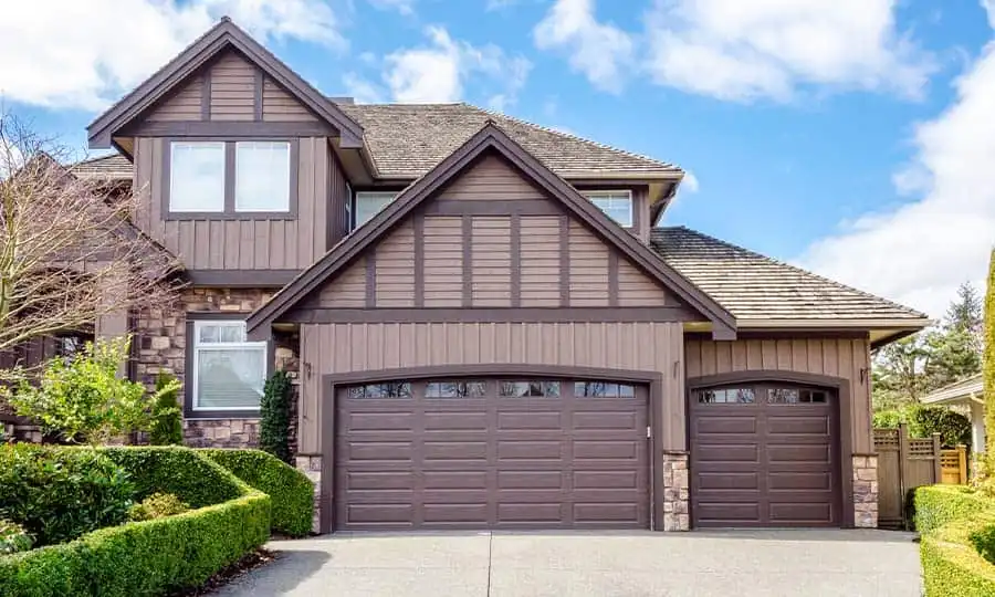Brown board and batten siding on craftsman style garage exterior