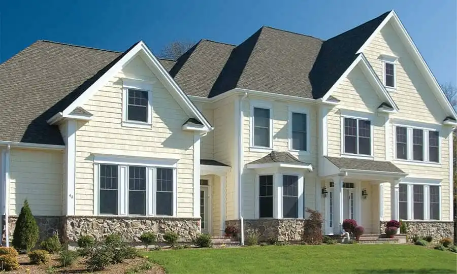 Light cream home exterior with cedar shake siding accents