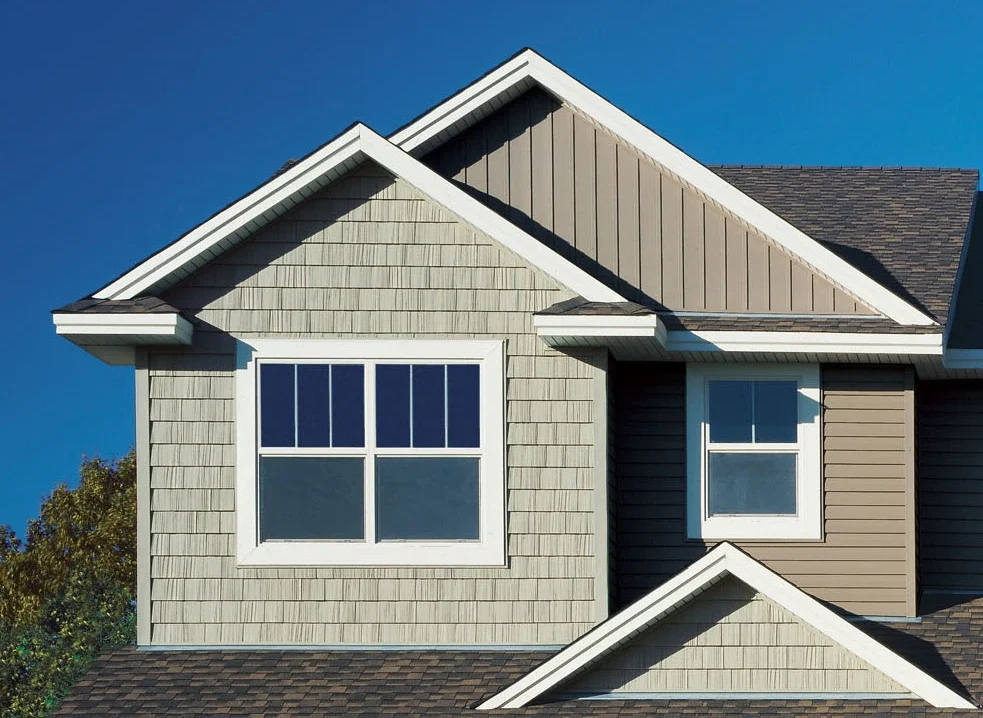 Gray shake siding with white trim on residential home exterior